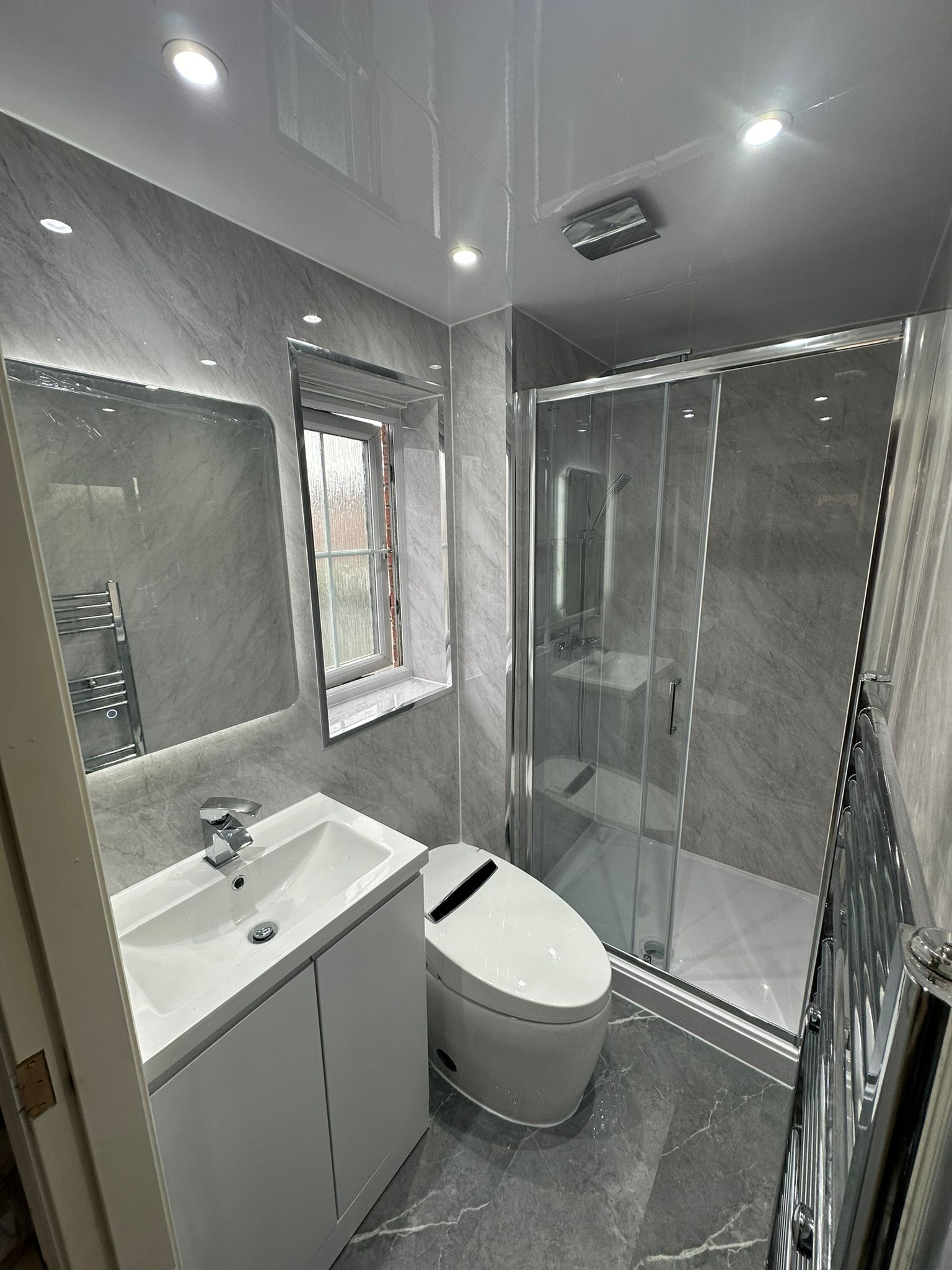 Finished bathroom using Grey Marble panels