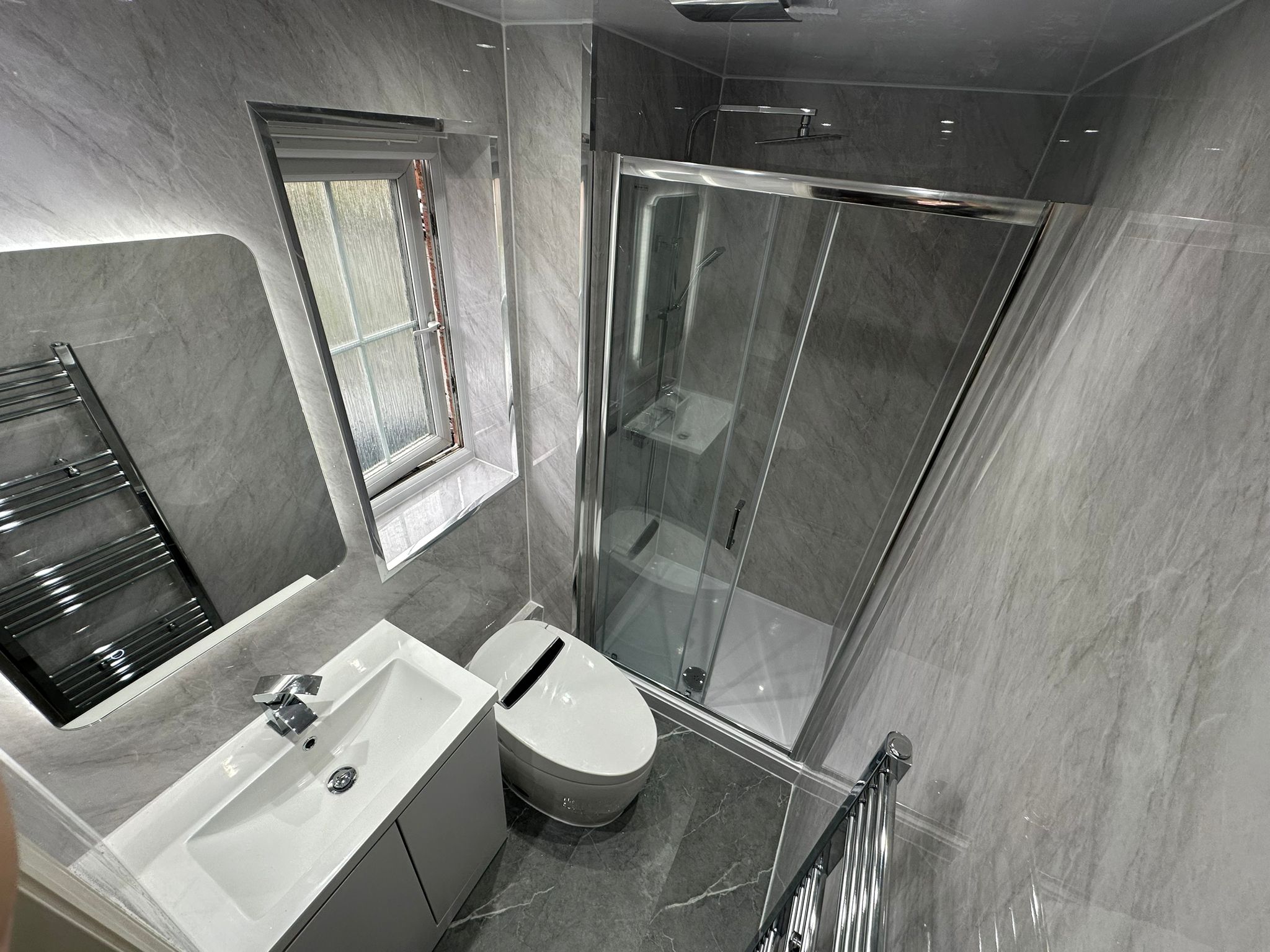 Finished bathroom using Grey Marble panels
