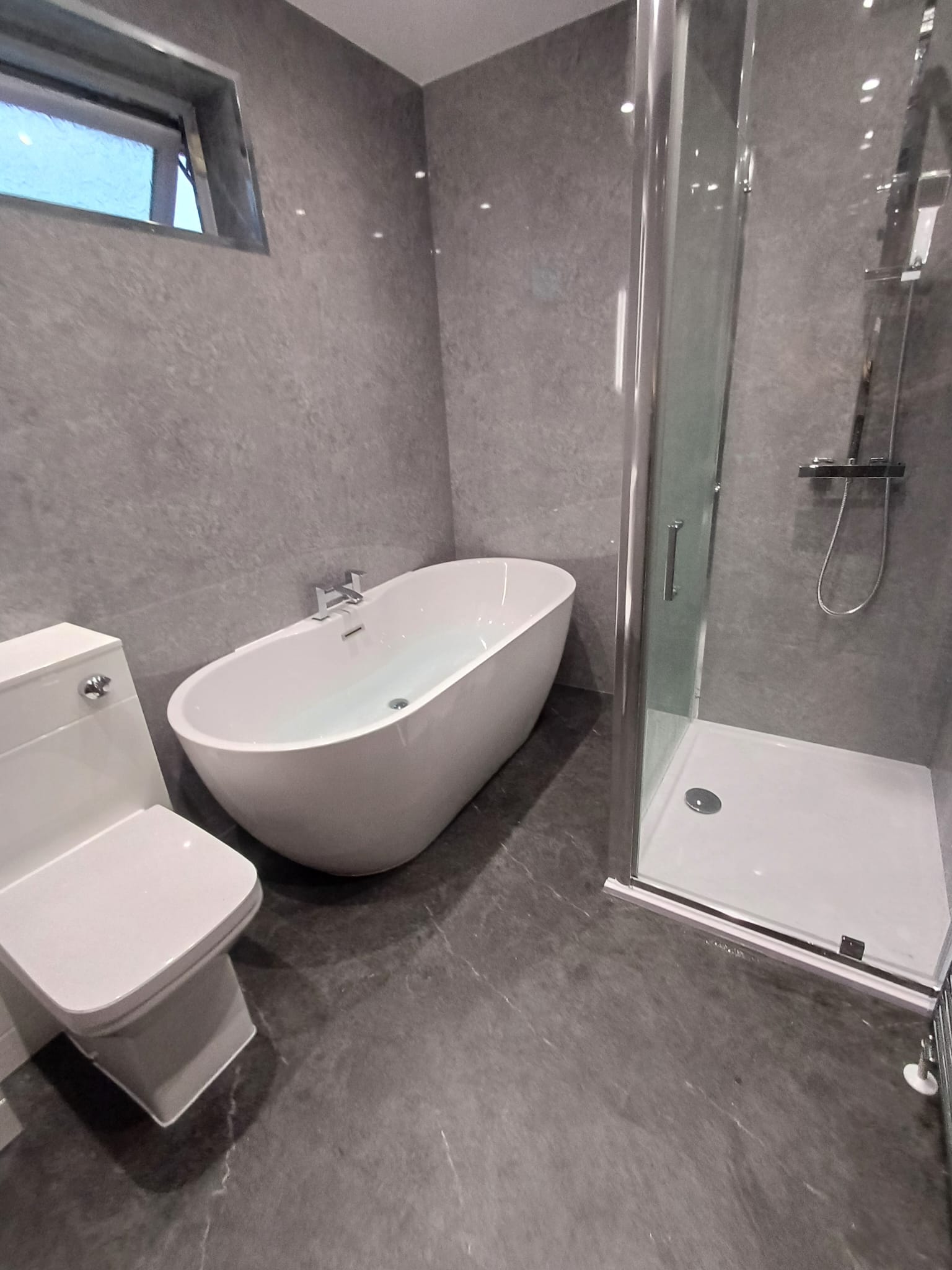 Finished bathroom using Grey Stone Gloss panels