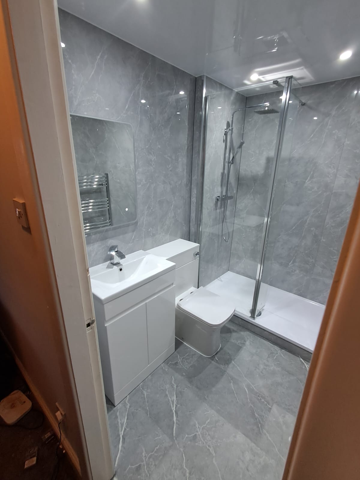 Finished bathroom using Light Grey Marble panels