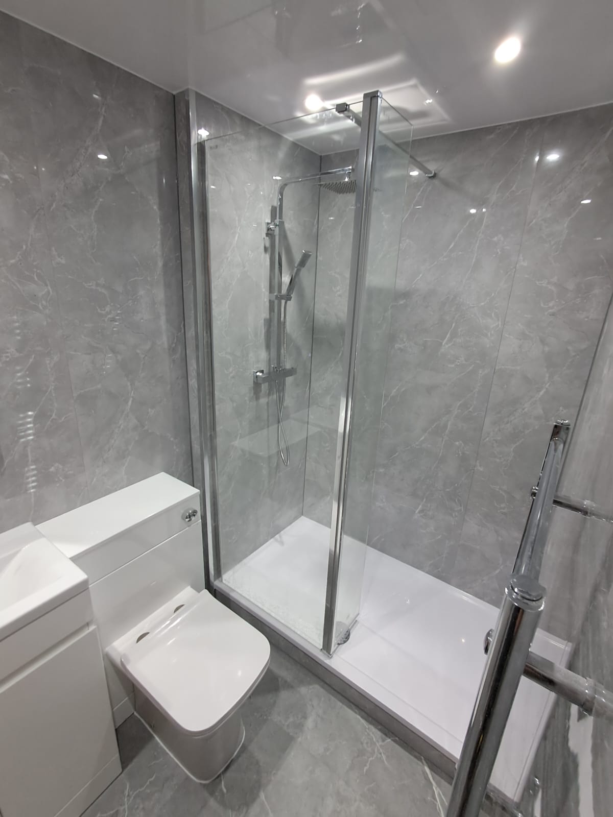 Finished bathroom using Light Grey Marble panels
