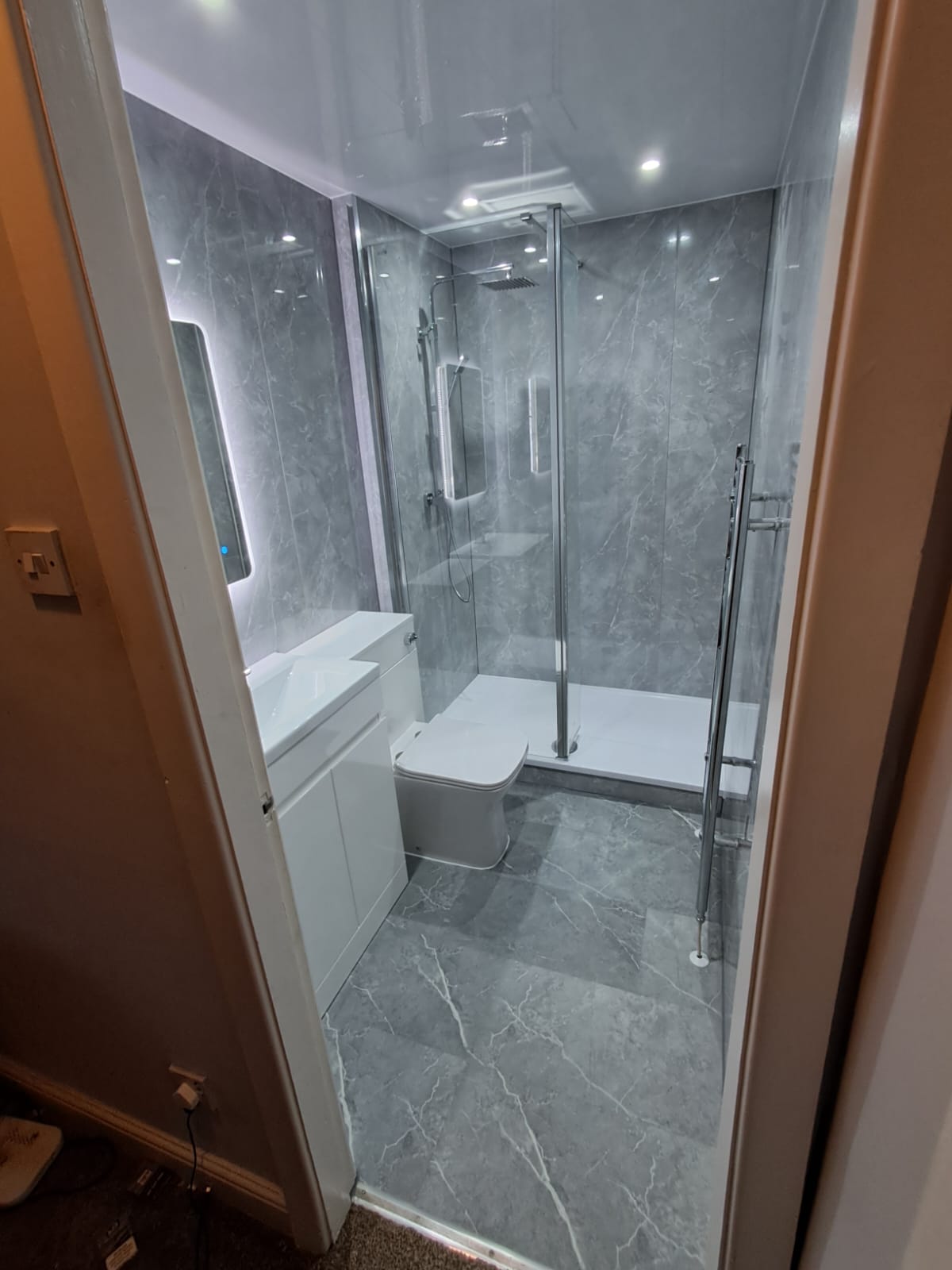 Finished bathroom using Light Grey Marble panels