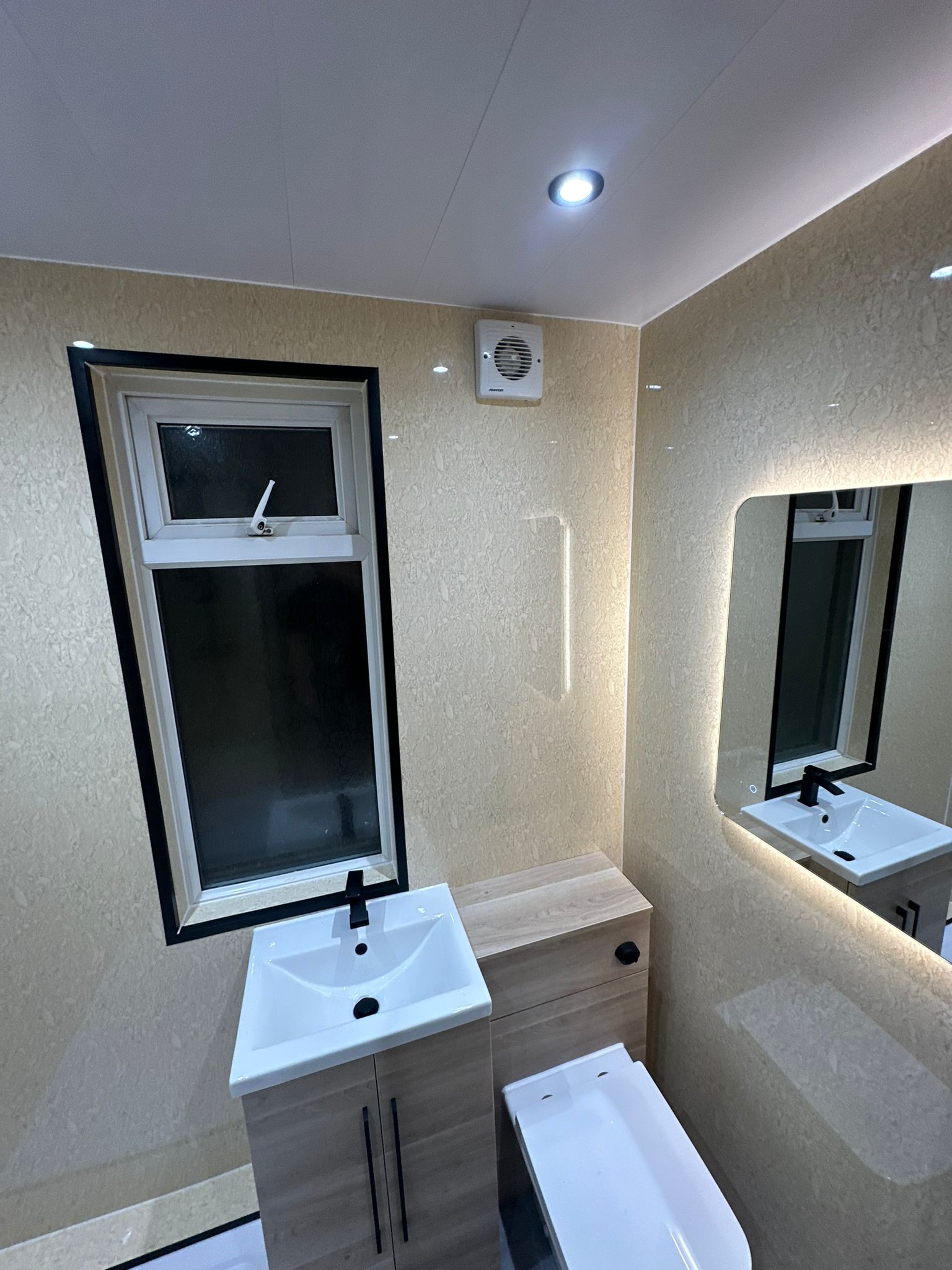 Finished bathroom using Travertine panels
