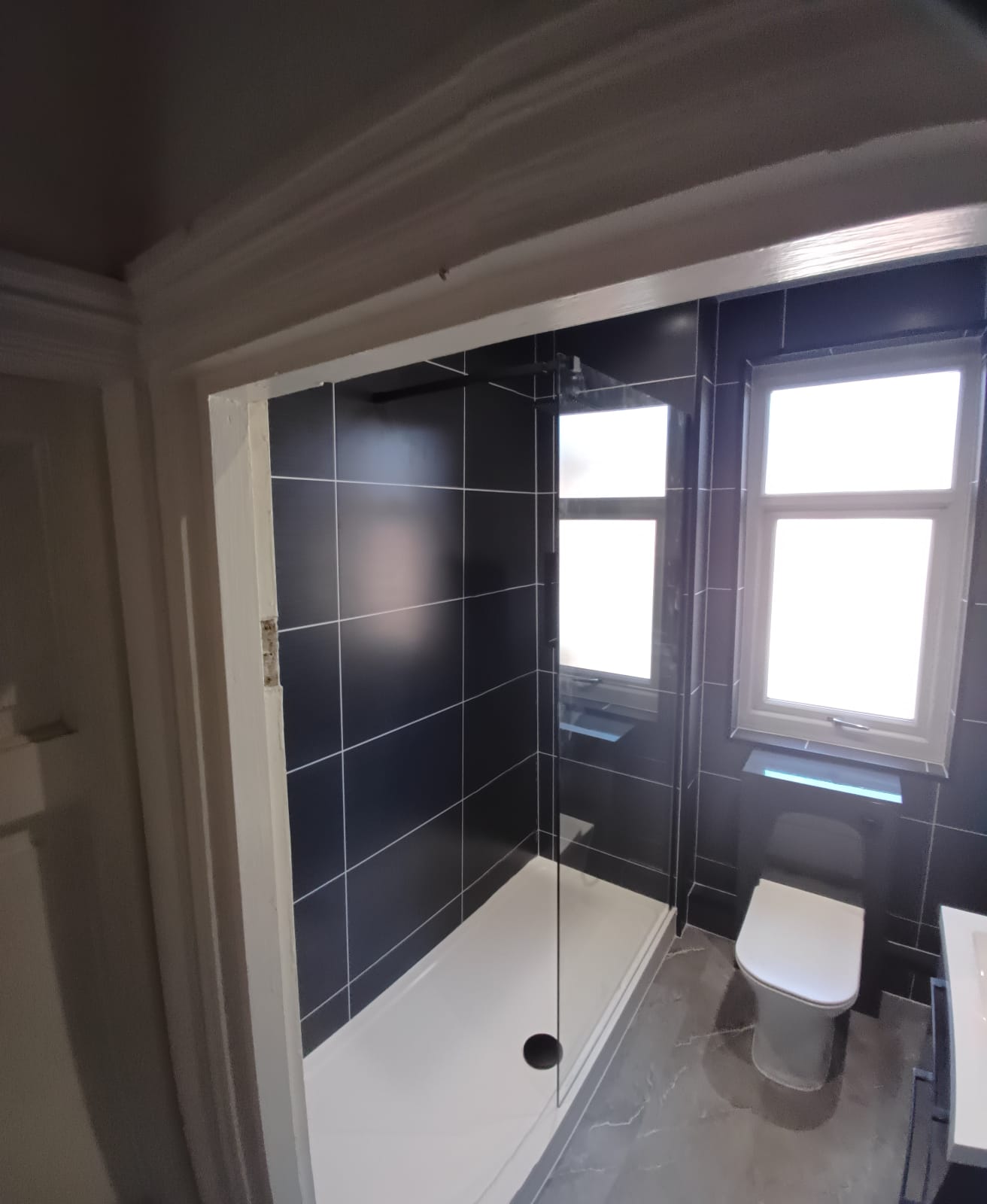 Finished bathroom using Dark Grey Ice Matt panels