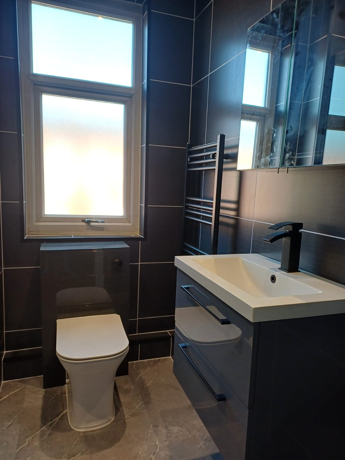 Finished bathroom using Dark Grey Ice Matt panels