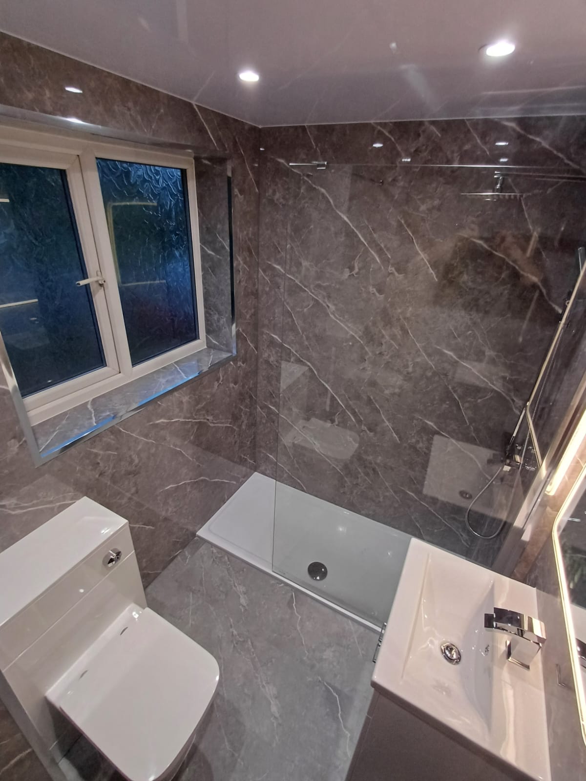 Finished bathroom using Dark Grey Marble Gloss panels