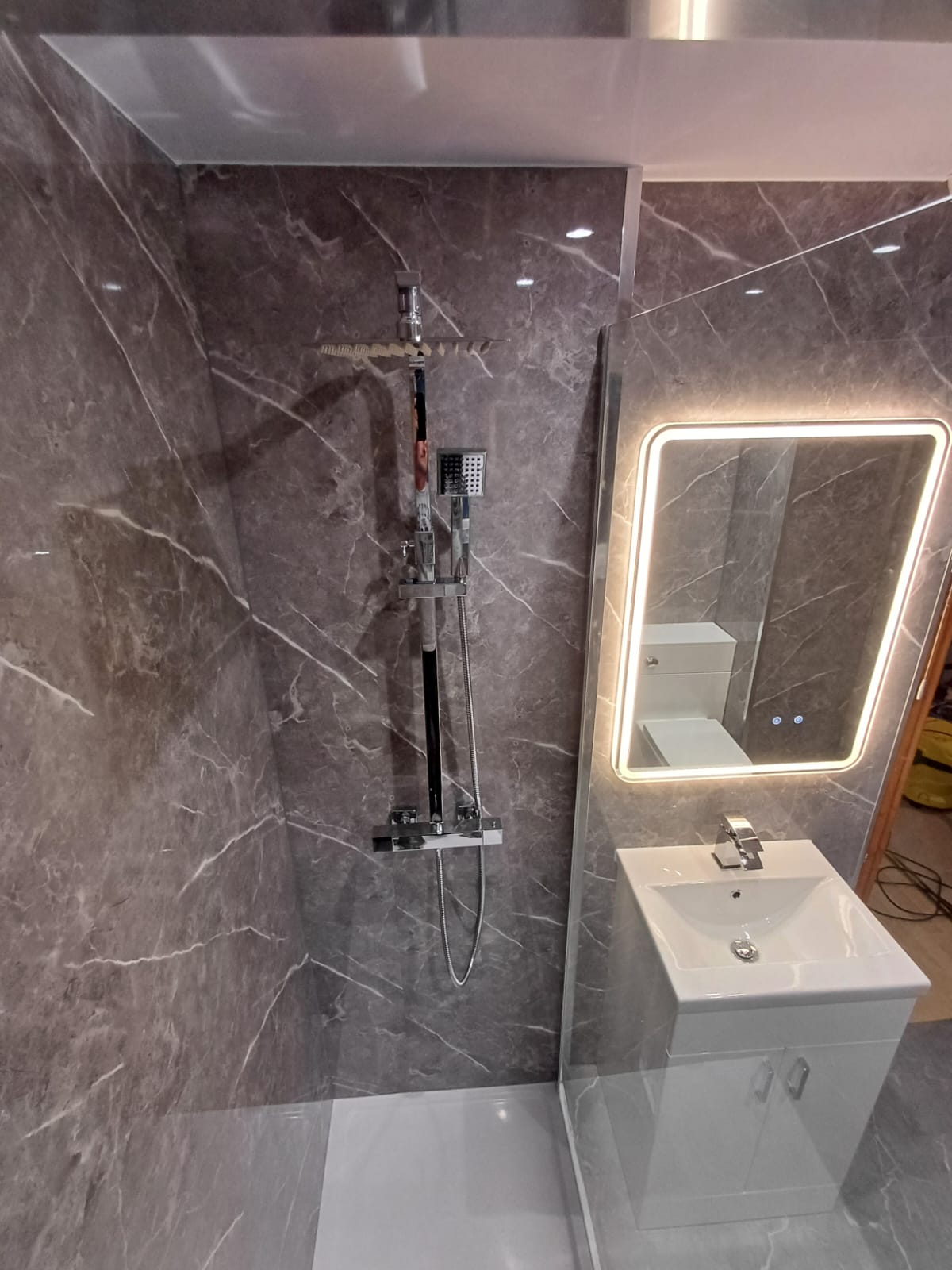 Finished bathroom using Dark Grey Marble Gloss panels