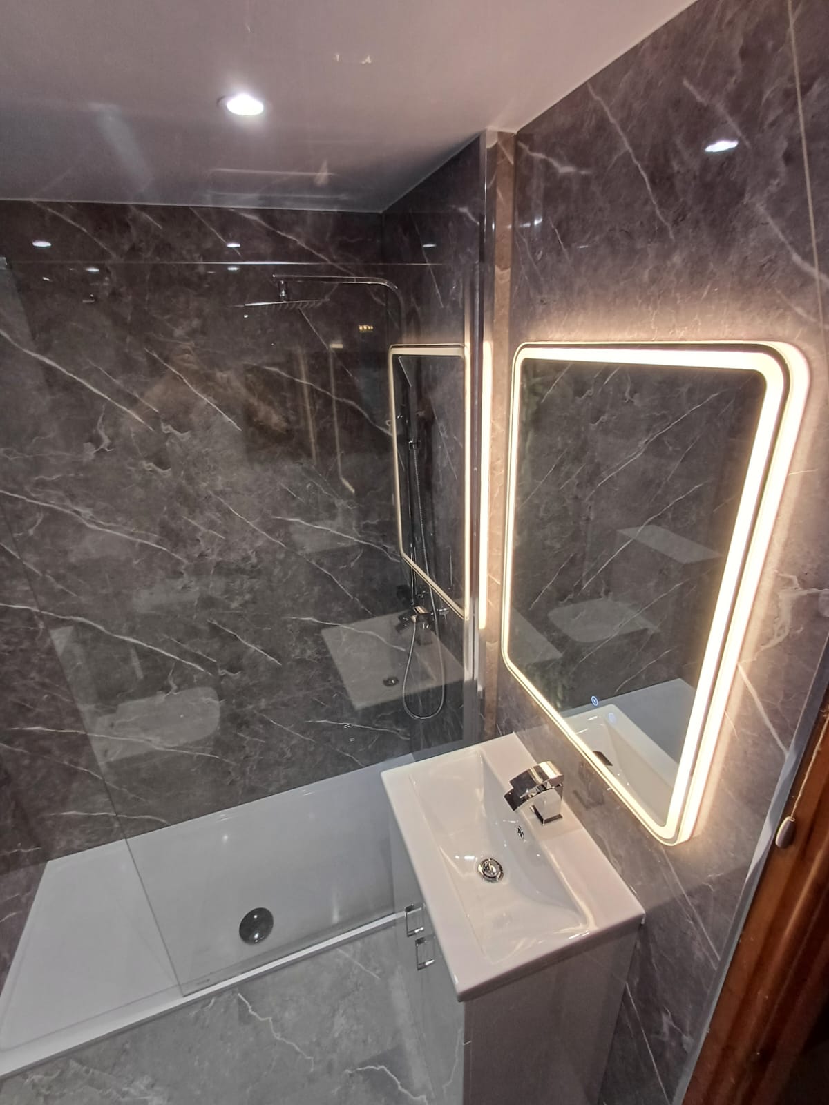 Finished bathroom using Dark Grey Marble Gloss panels