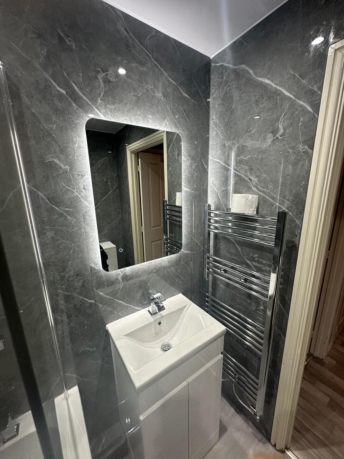 Finished bathroom using Dark Grey Marble Gloss panels