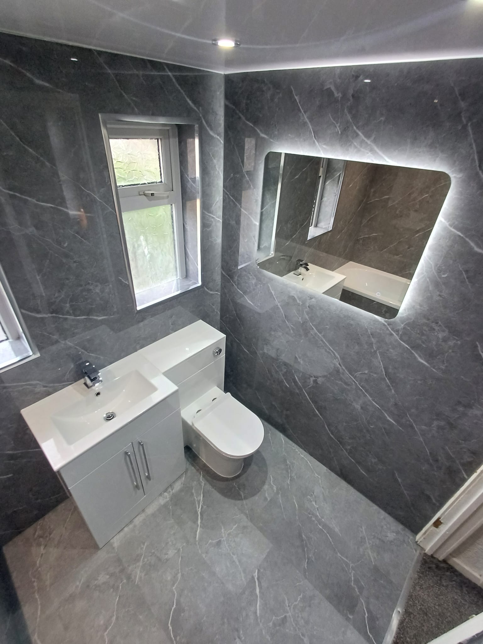 Finished bathroom using Dark Grey Marble Gloss panels