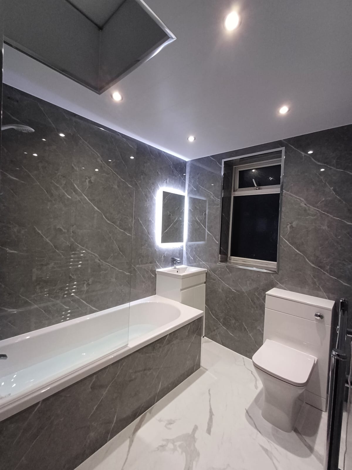 Finished bathroom using Dark Grey Marble Gloss panels