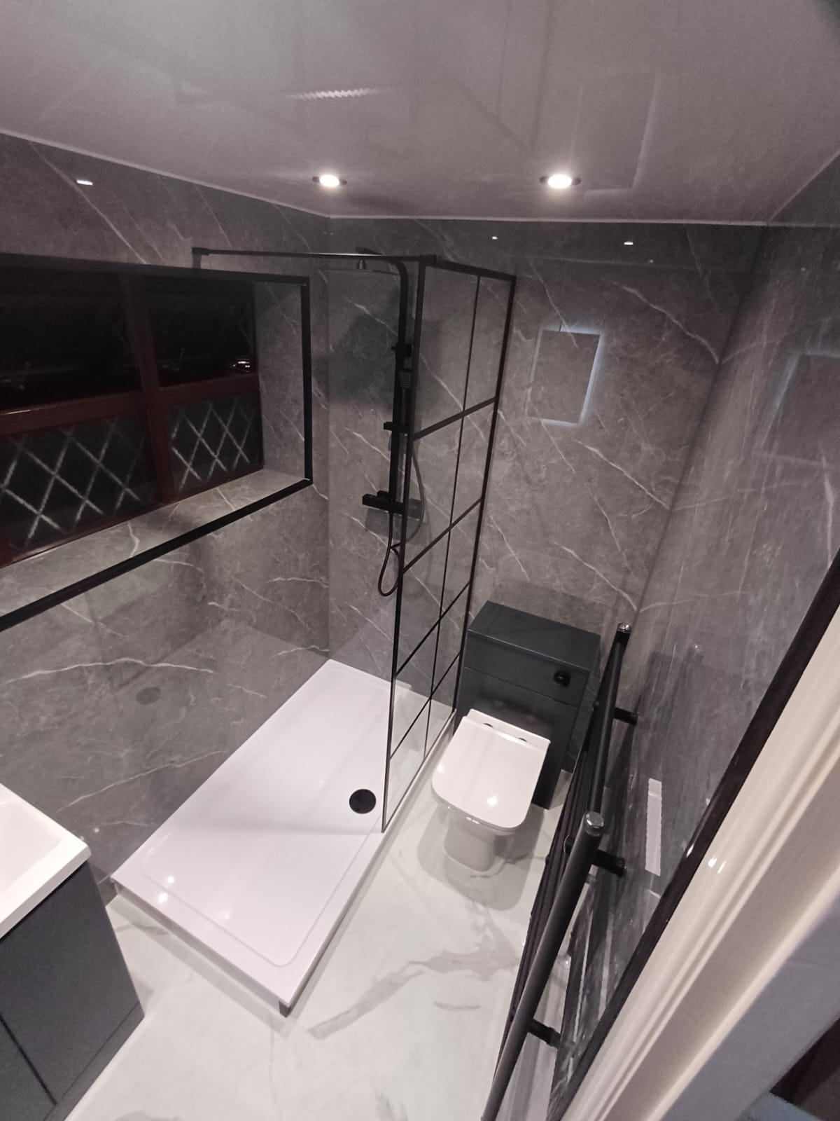 Finished bathroom using Dark Grey Marble Gloss panels