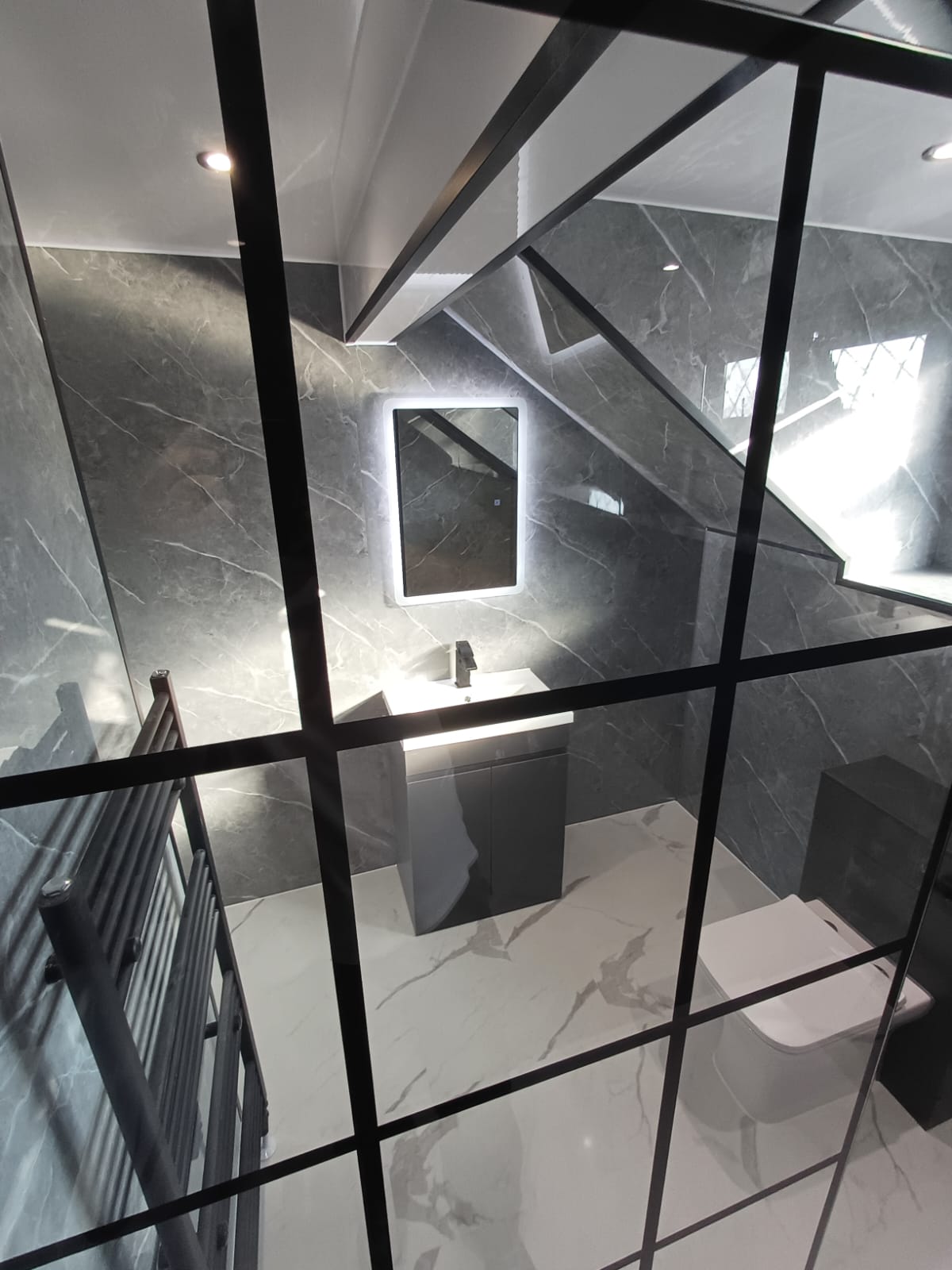 Finished bathroom using Dark Grey Marble Gloss panels